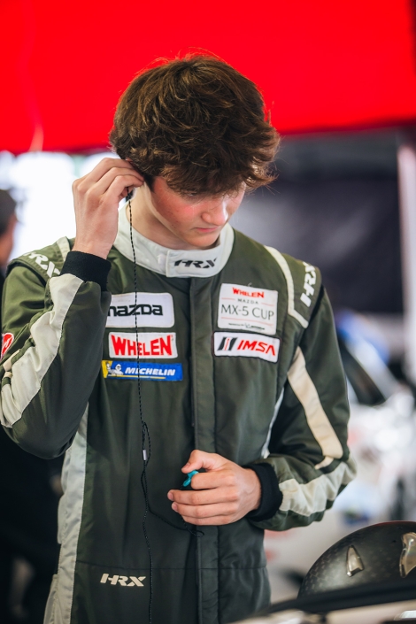 Vaughn Mishko puts in an earbud